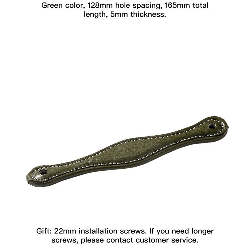 Green leather-wrapped drawer pulls and cabinet handles, modern farmhouse style, with white stitching.
